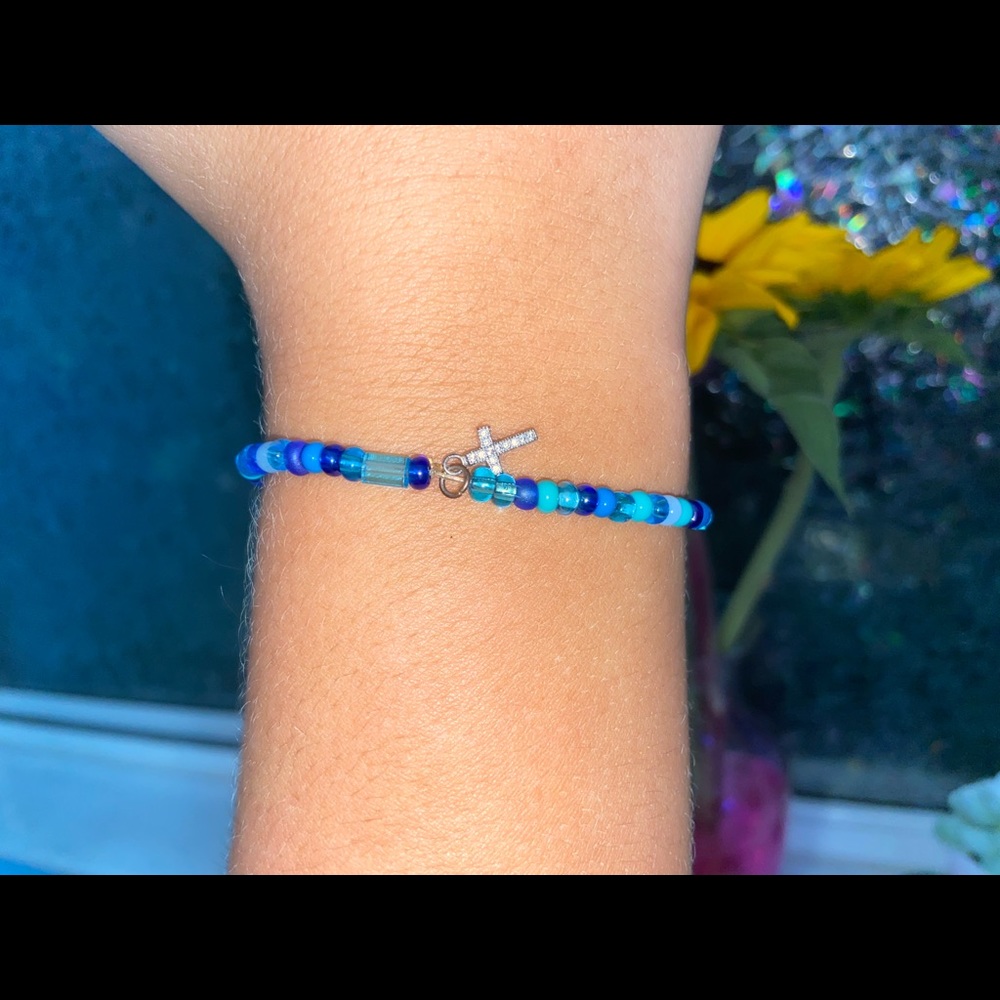 blue bead cross bracelet